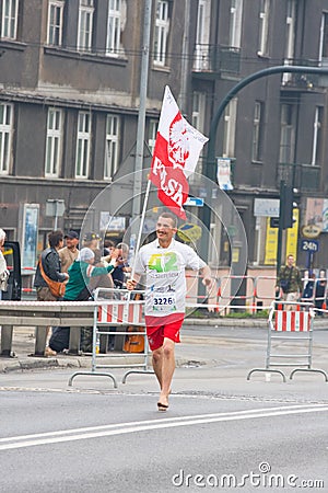 KRAKOW, POLAND - APRIL 28 : Cracovia Marathon. Barefoot runner on the city streets