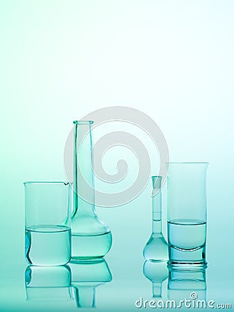 Laboratory glass utensils on blue background