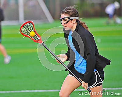 Lacrosse girl cradling the ball