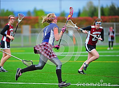 Lacrosse girls cradling the ball