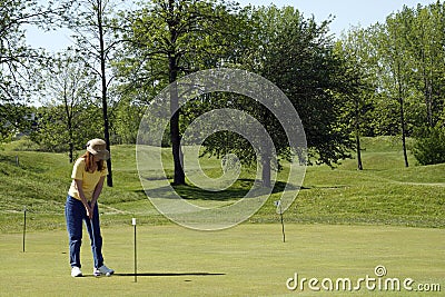 Lady Golfer On Practice Green