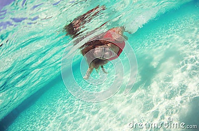 Lady in red swim dress water sea diving