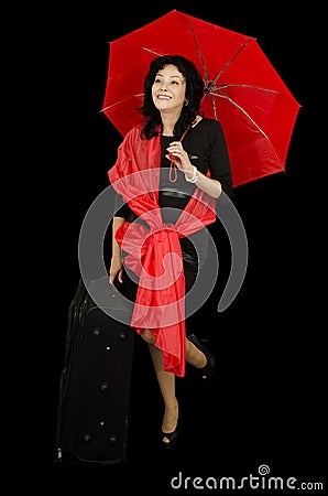 Lady with red umbrella standing on one leg