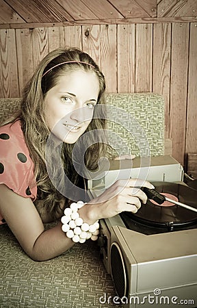 Lady with vinyl plate and record player