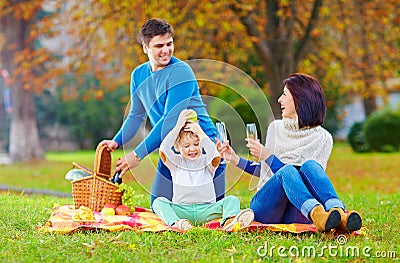 Laid-back moment of family on autumn picnic