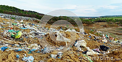 Land polluted with plastic bags and waste