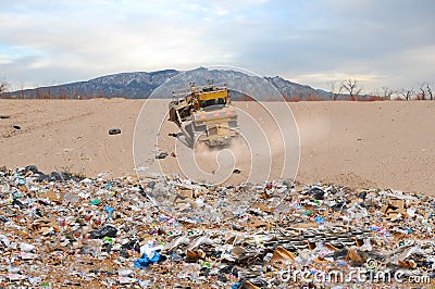 Landfill and tractor in desert