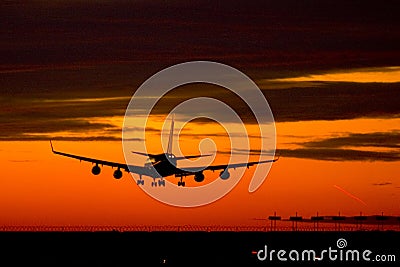 Landing plane on a sunset