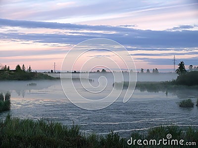 The landscape of the Northern nature. Fog over the river Nadym.