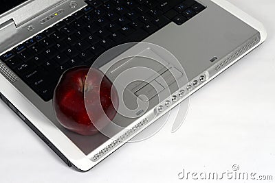 Laptop and red apple