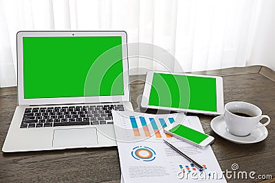 Laptop, tablet , smartphone with financial financial documents