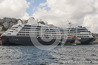 Large cruise ship moored on river