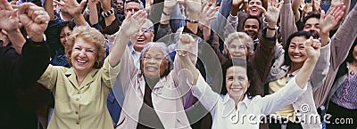 Large group of multi-ethnic people cheering with arms raised