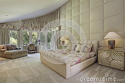 Large master bedroom with doors to balcony