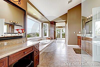 Large modern luxury new master bathroom in brown.