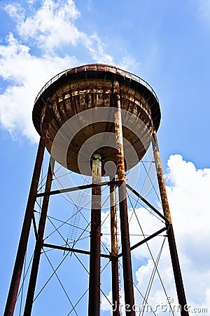 A large water tank and a bright sky