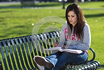 Latino Woman student studying