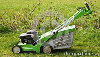 Lawn mower on fresh cut grass