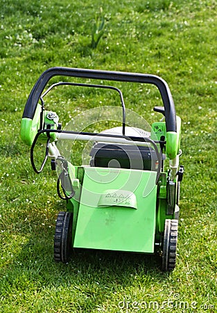 Lawn mower on fresh cut grass