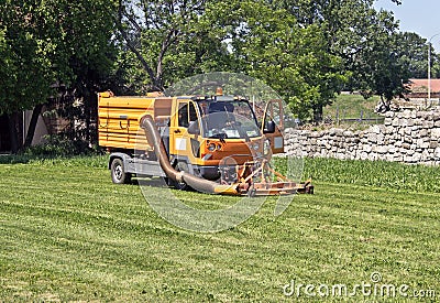 Lawn mower yellow truck