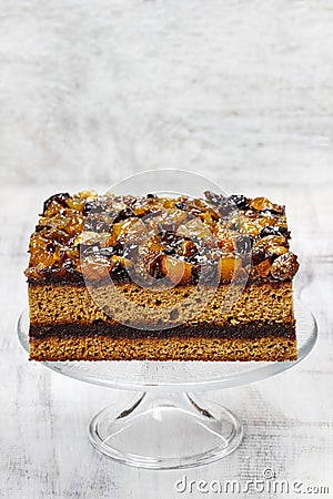 Layer cake decorated with dried fruits and honey