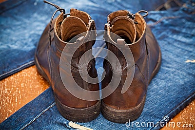 Leather shoes brown and blue jeans