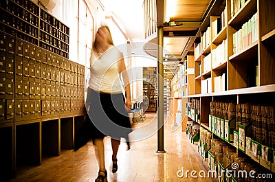 Librarian In A Library Aisle Royalty Free Stock 