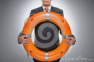 Life buoy for your business. Businessman holding a life belt whi