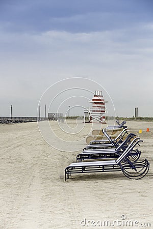 Lifeguard tower and lounge chairs in South Beach, Miami, Florida.