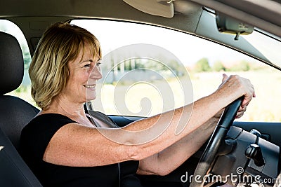 Senior woman driving car