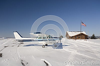 Light airplane on airport in winter