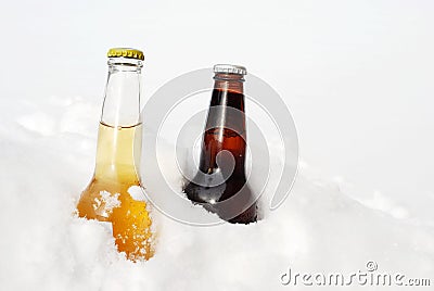 Light and dark beer in the snow