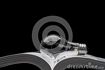 Lightbulb on a book showing ideas from inspiration