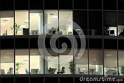 Lighted windows of deserted office at night