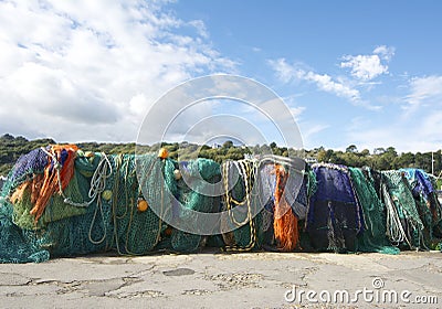 A line of colourful fishing nets.