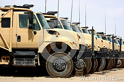 Line of military transportation trucks