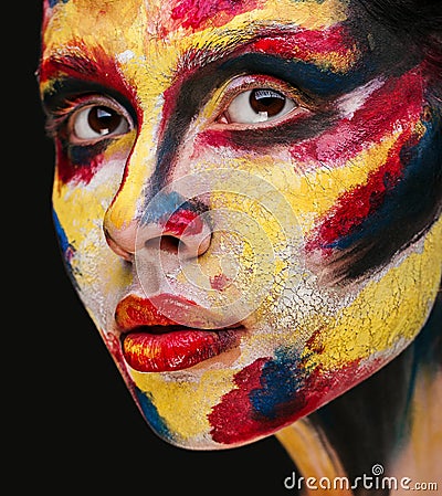 Lips of beautiful young girl with paint on his face