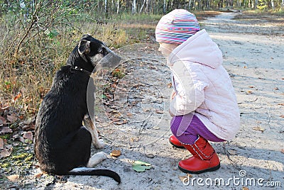 So! Listen to ME! Training a dog Little Girl in a birch forest.