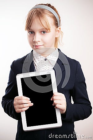 Little blond girl holds tablet device