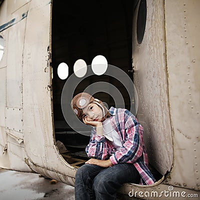 Little boy dreaming of being pilot