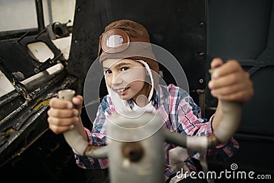 Little boy dreaming of being pilot