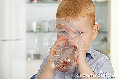 Little boy drinks water