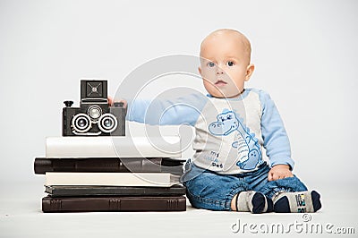 Little boy with a film camera