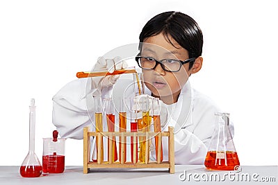 Little boy mixes the chemistry