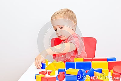 Little boy playing with toys, early education