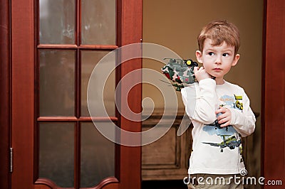 Little boy with toy helicopter