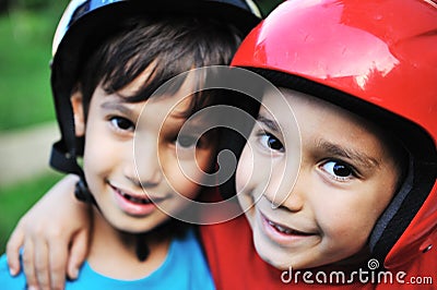 Little boys with biking safety helmet