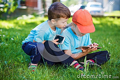 Little boys playing on wireless tools