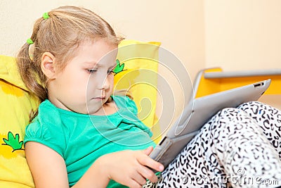 Little Caucasian girl with digital tablet pc