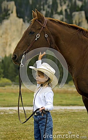 Little Cowgirl and Her Horse